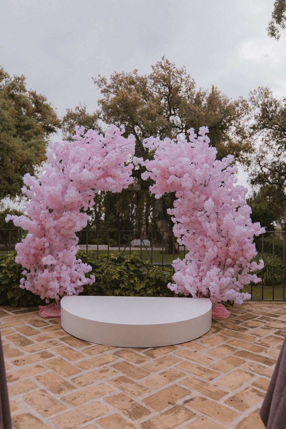 Pink cherry blossom wedding arch backdrop, Marbella