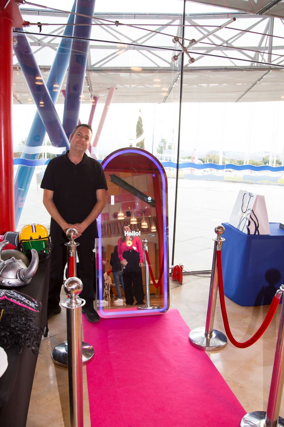 Magic Mirror photo booth on a pink carpet with red velvet ropes, Marbella event